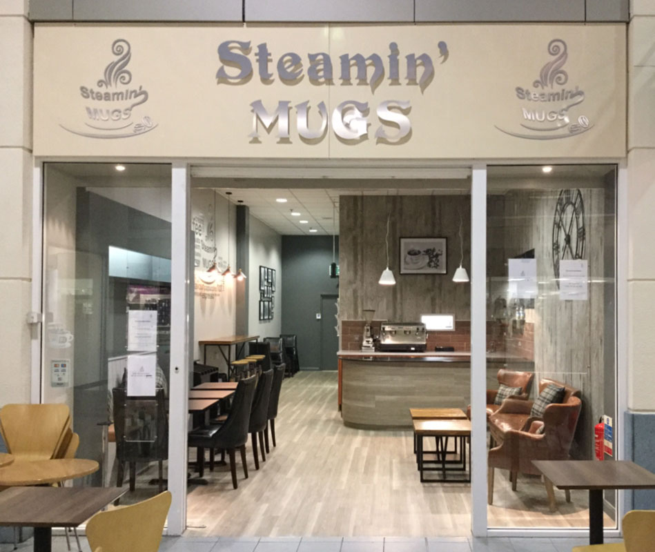 Steaming Mugs Coffe Shop