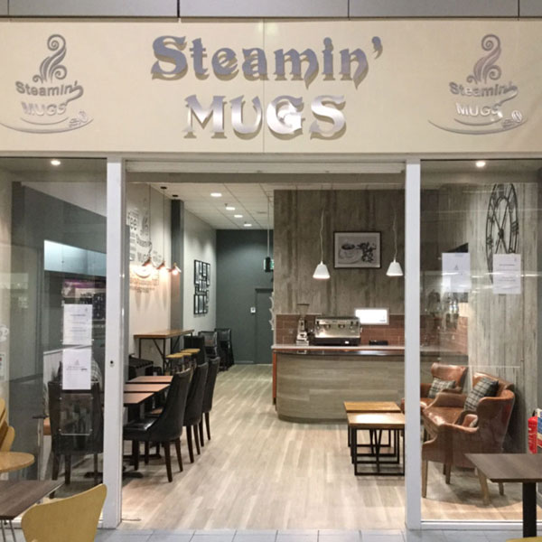 Steaming Mugs Coffe Shop